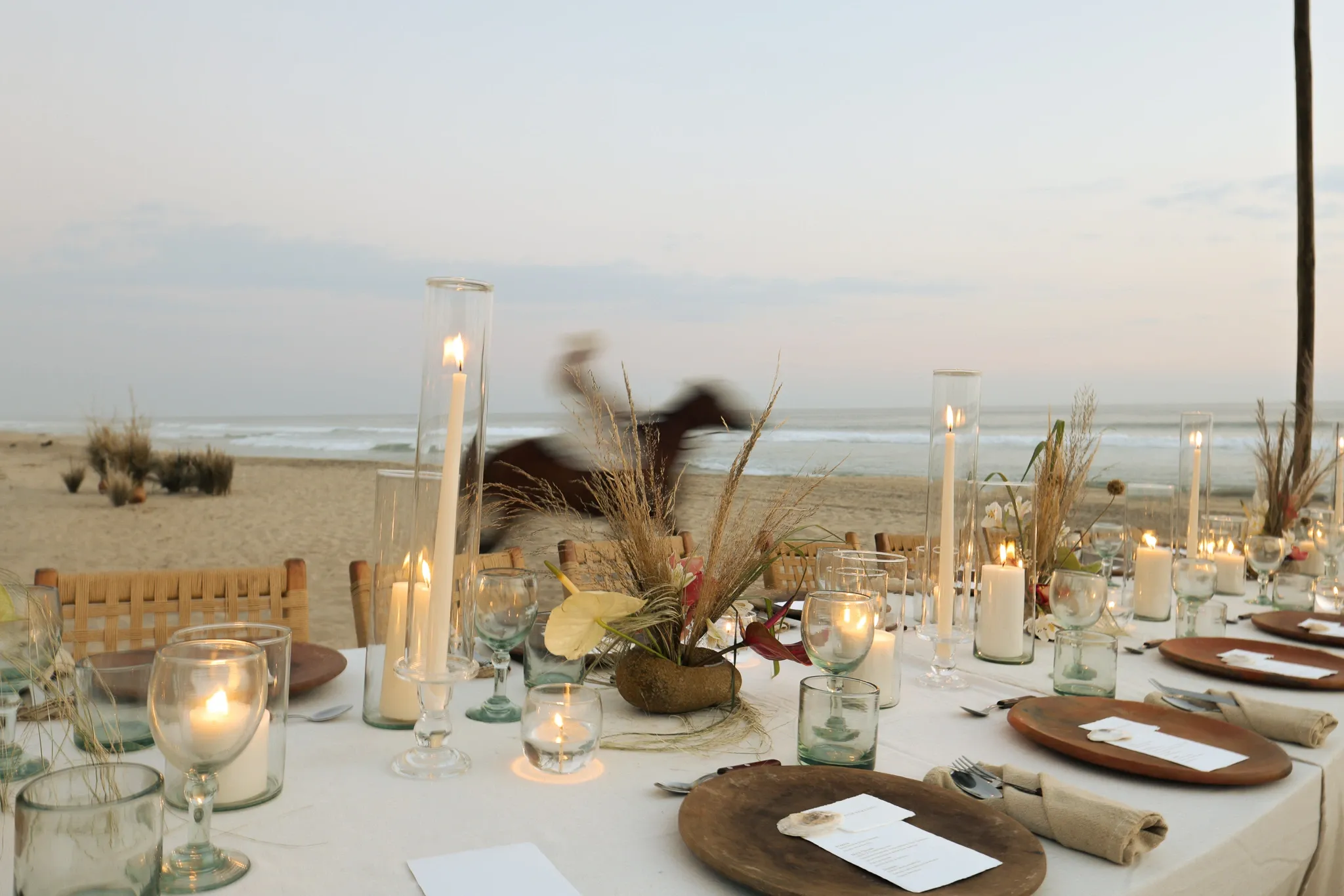 Wedding bench with flower arch in front of the sea