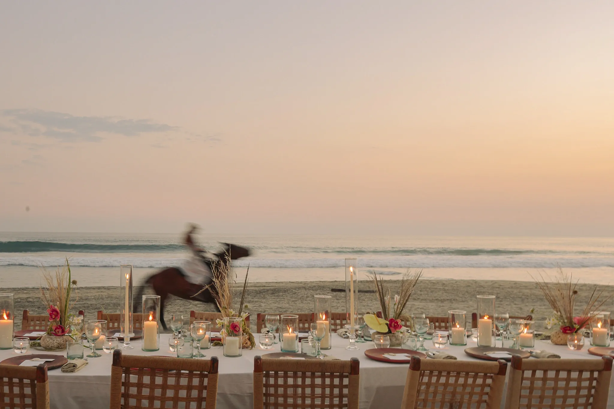 Wedding bench with flower arch in front of the sea