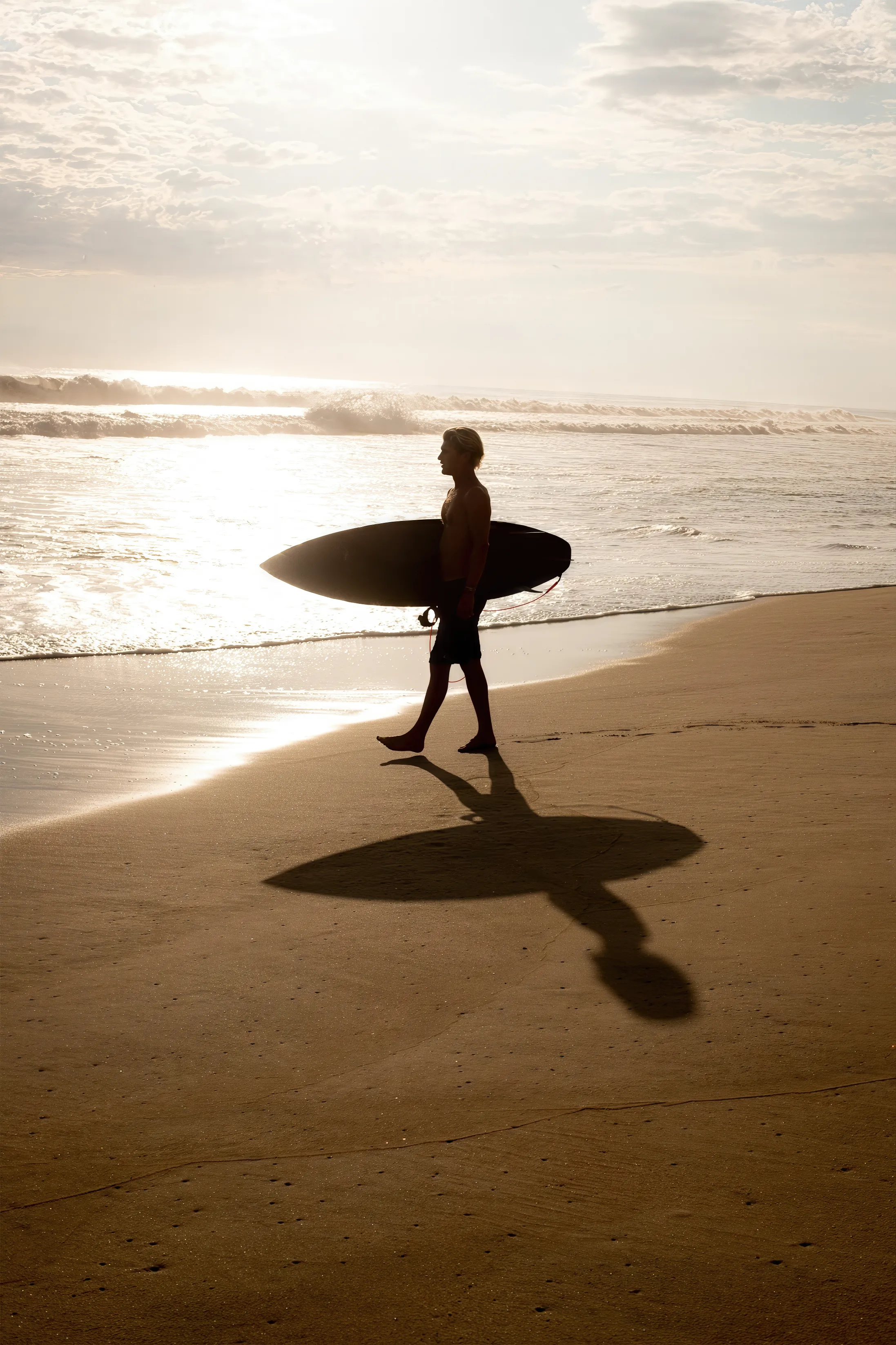 Handsome man going to surf